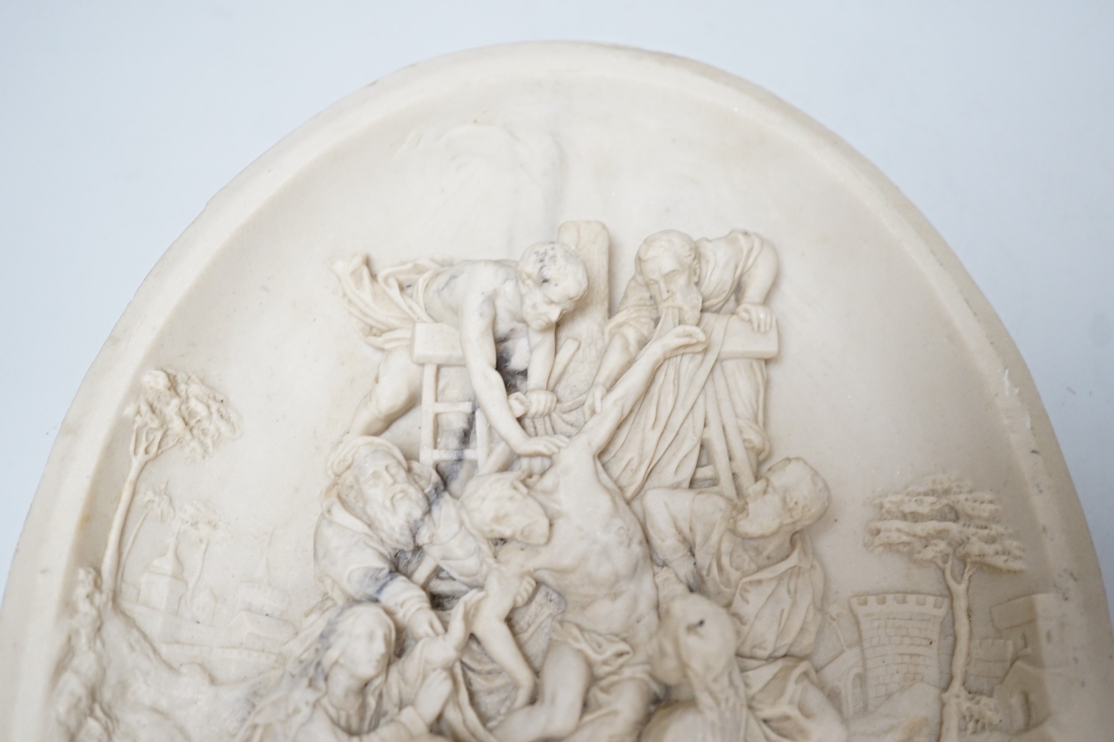 A reproduction reconstituted marble oval plaque with inset coin to reverse, 30cm